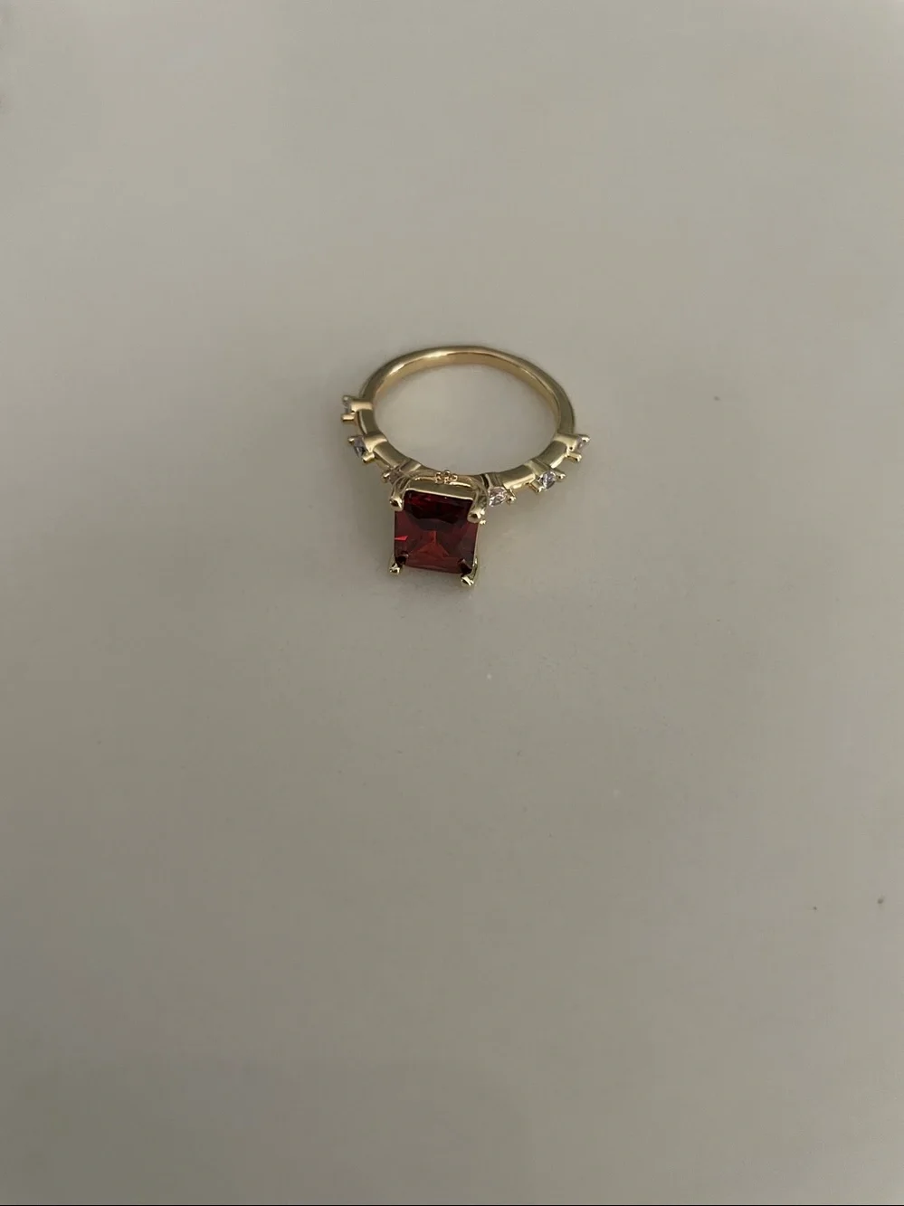Gold tone Ring with Square red / orange colored center  and Accent Stones